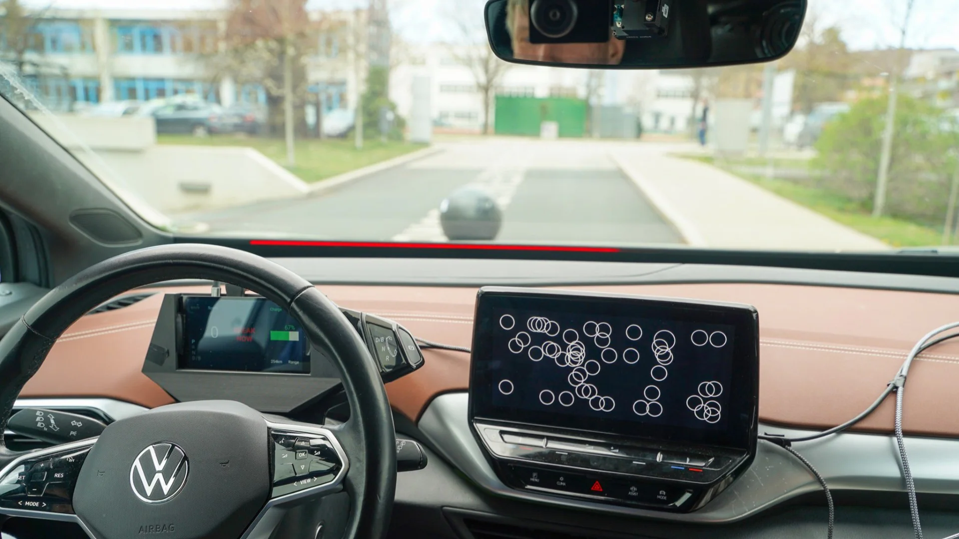 Android Automotive collision-warning study setup inside a test vehicle